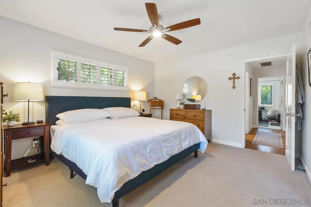 6365 Lambda Drive San Diego, CA 92120 - Photo 15 of 31 a bedroom with a bed and a large mirror