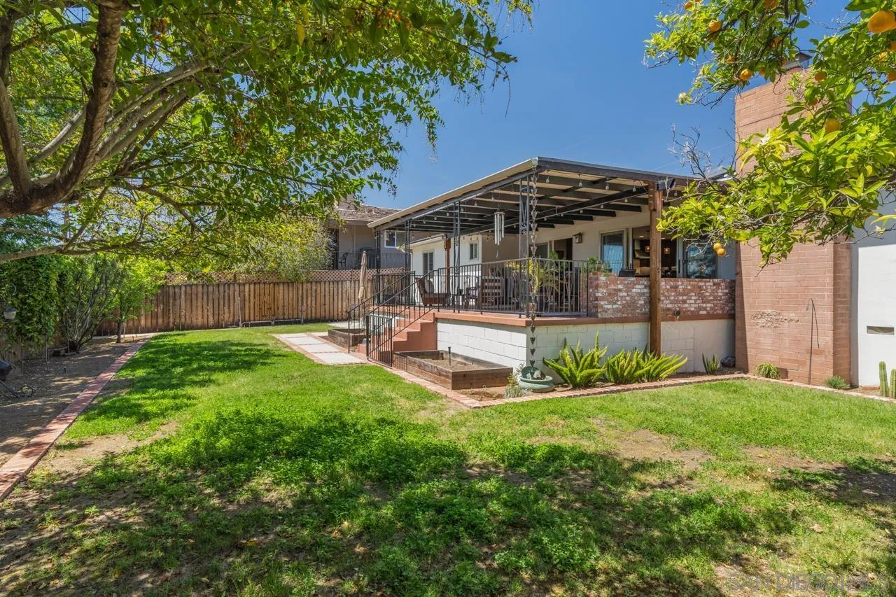 6365 Lambda Drive San Diego, CA 92120 - Photo 23 of 31 a view of a house with backyard and sitting area