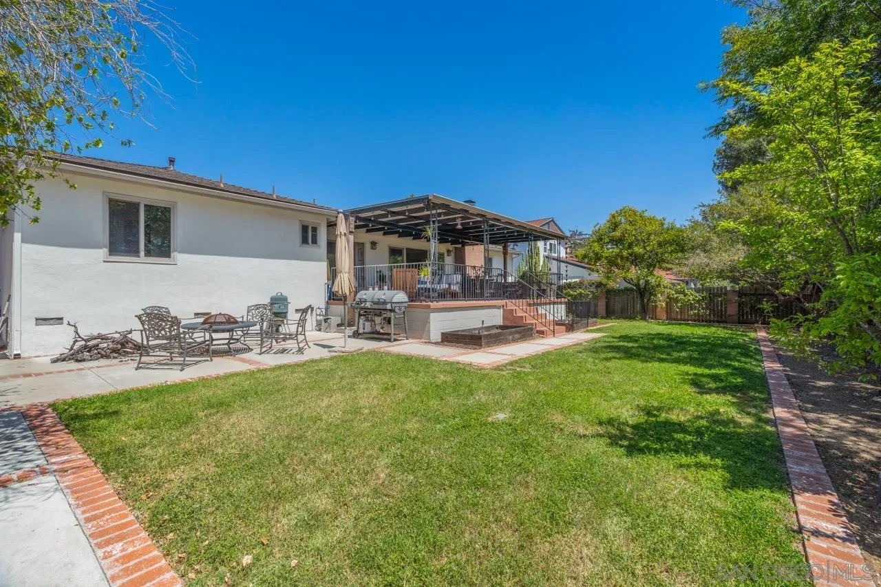 6365 Lambda Drive San Diego, CA 92120 - Photo 24 of 31 a front view of a house with patio swimming pool and sitting area