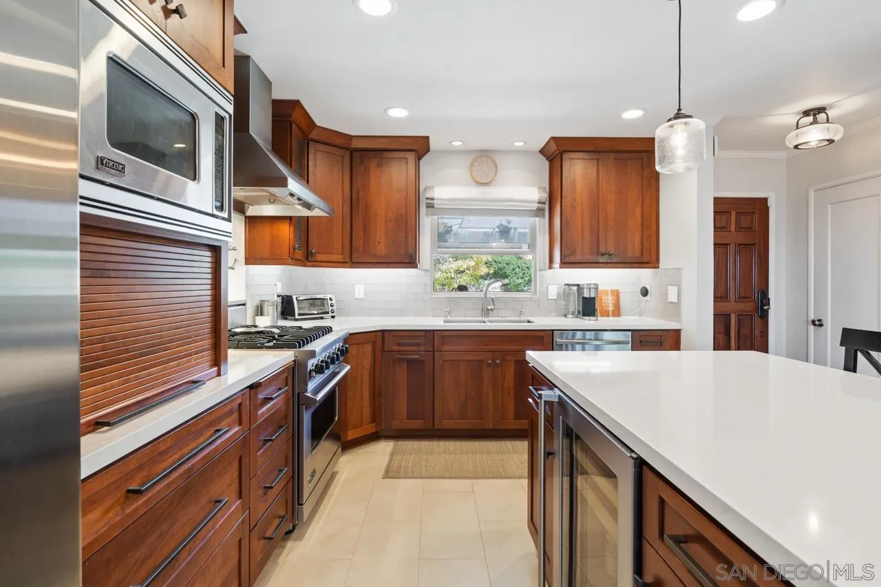 6365 Lambda Drive San Diego, CA 92120 - Photo 4 of 31 a kitchen with stainless steel appliances granite countertop a sink and a stove