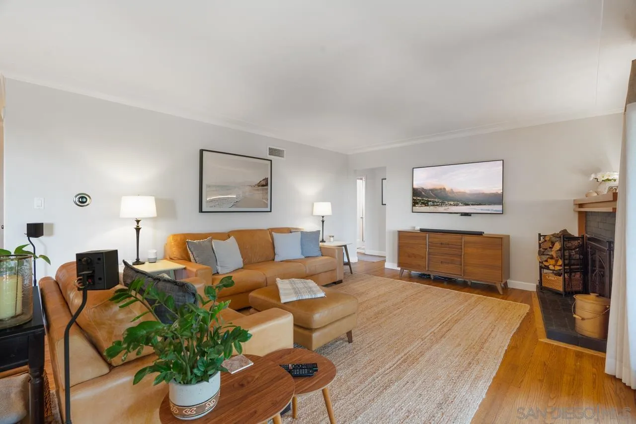 6365 Lambda Drive San Diego, CA 92120 - Photo 8 of 31 a living room with furniture and a flat screen tv