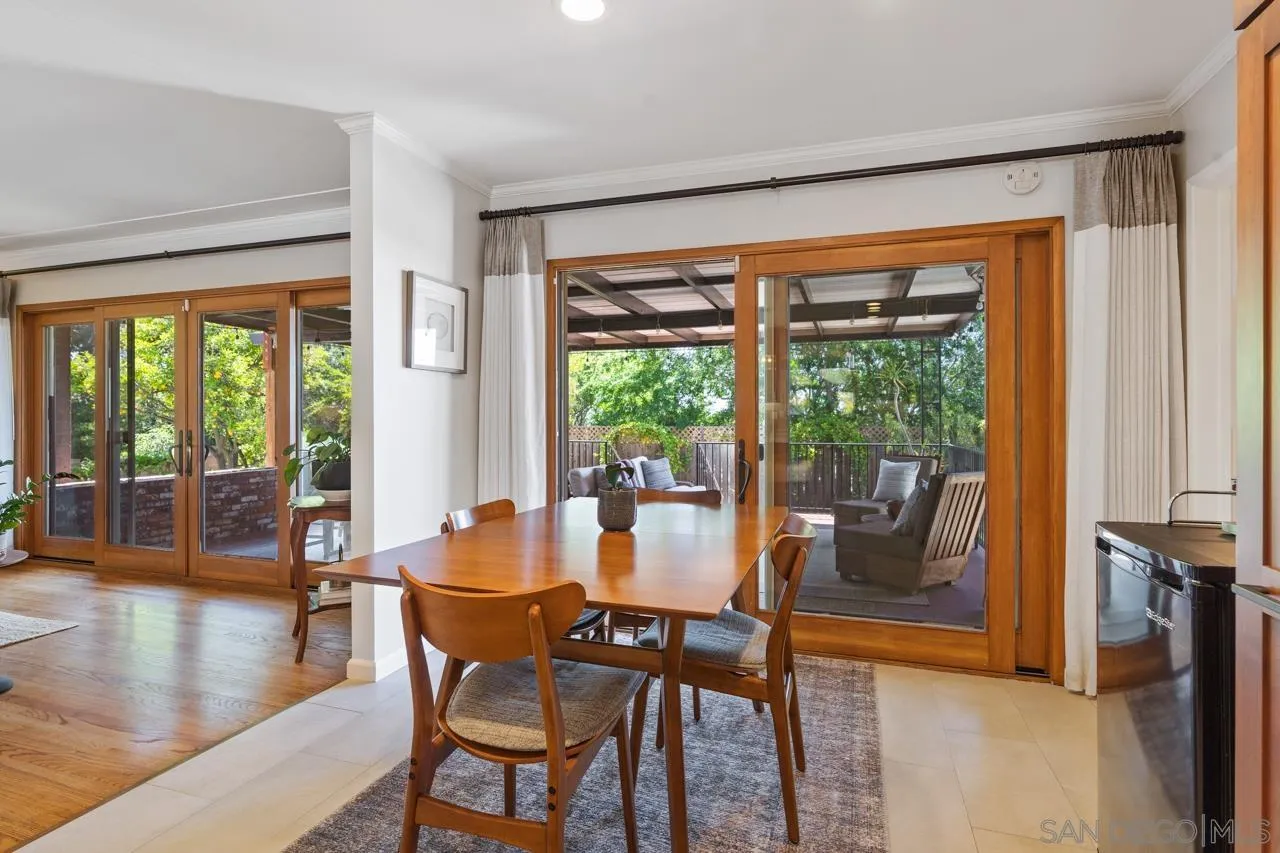 6365 Lambda Drive San Diego, CA 92120 - Photo 9 of 31 a dining room with furniture window and wooden floor