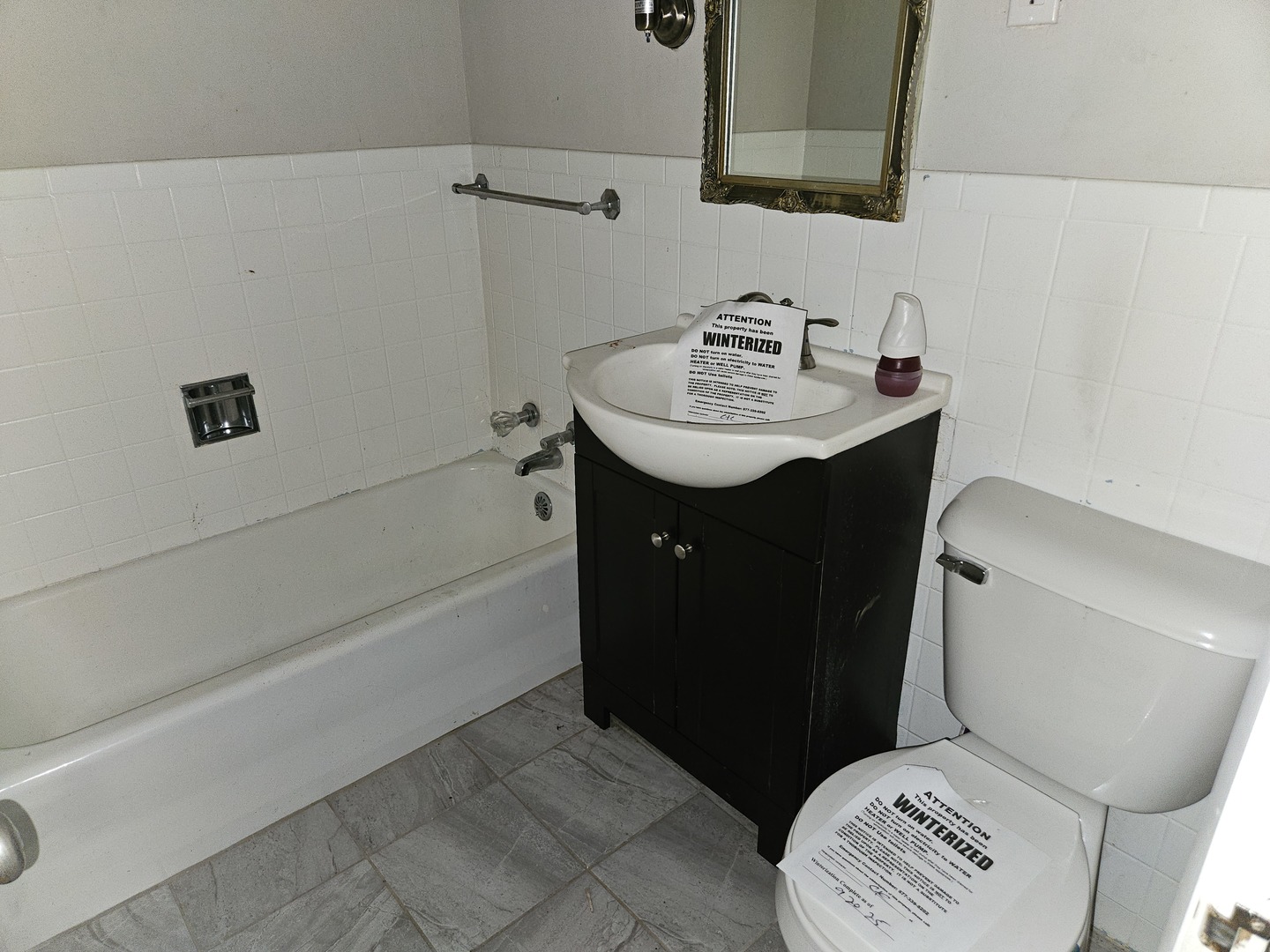 621 North 7th Street Herrin, IL 62948 - Photo 12 of 19 a bathroom with a sink toilet vanity and tub