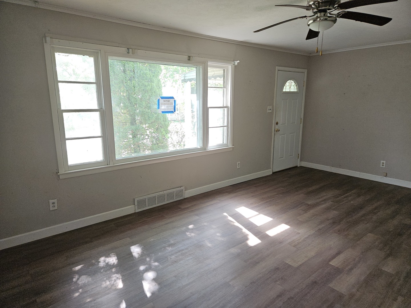 621 North 7th Street Herrin, IL 62948 - Photo 7 of 19 a view of empty room with wooden floor and fan