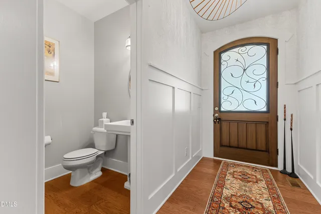 a view of an entryway with wooden floor