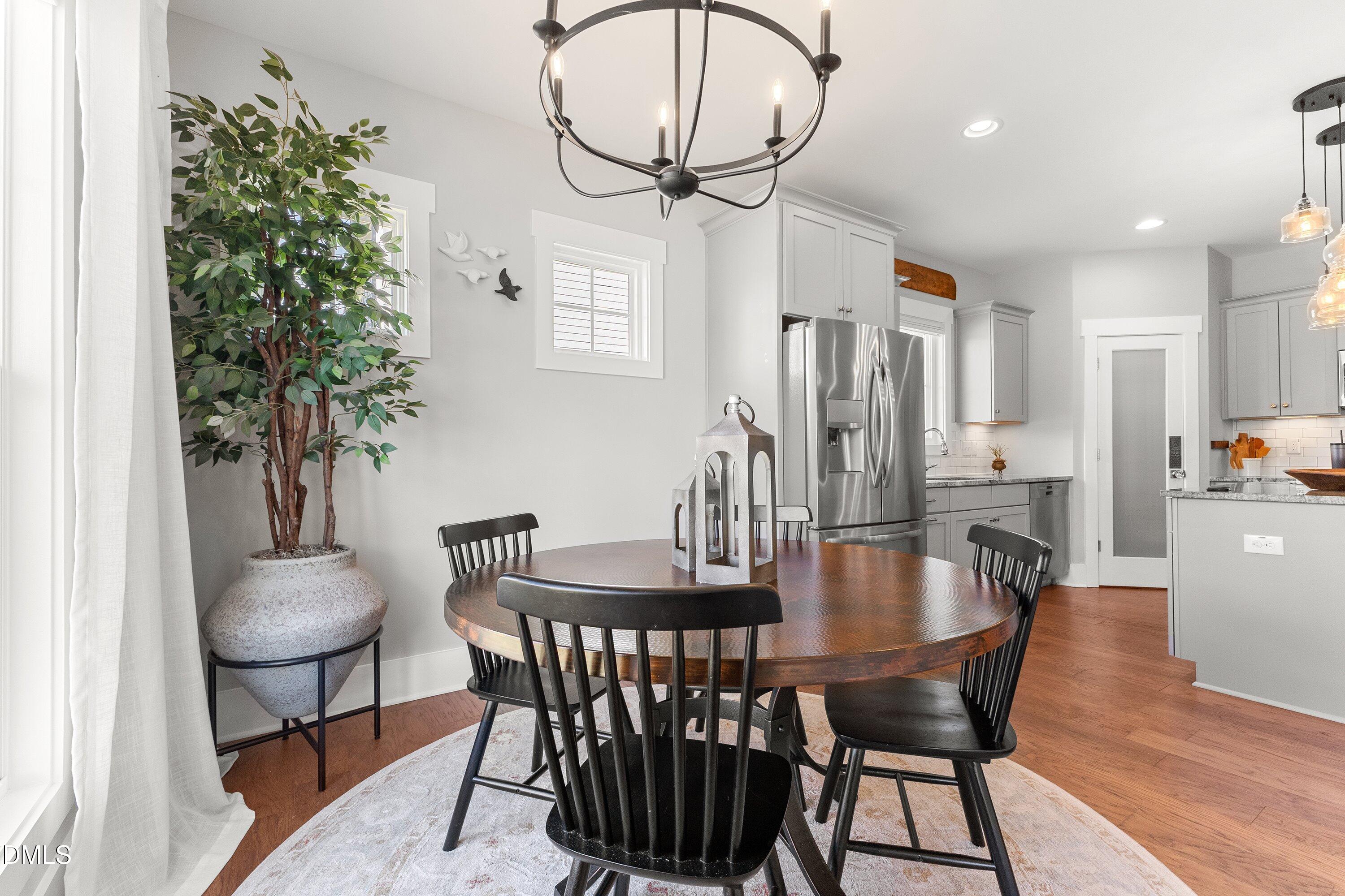 248 Old Hickory Drive Raleigh, NC 27603 - Photo 20 of 45 a view of a dining room with furniture and wooden floor