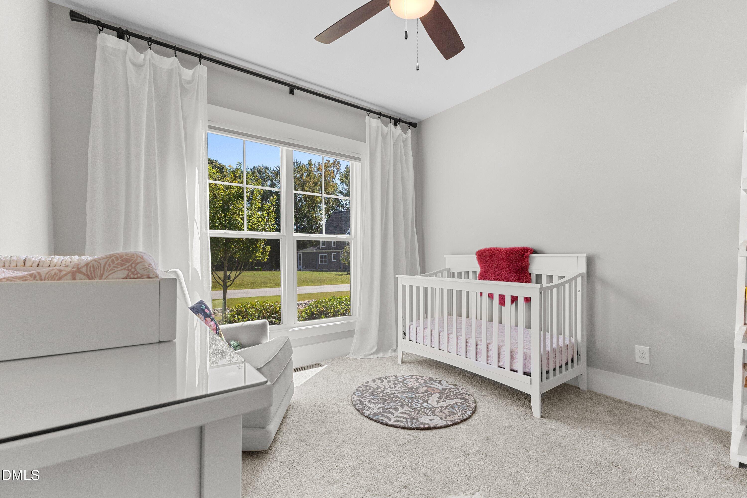 248 Old Hickory Drive Raleigh, NC 27603 - Photo 24 of 45 a living room with a baby crib furniture and a window