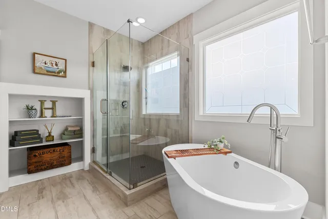 a spacious bedroom with a bed and furniture