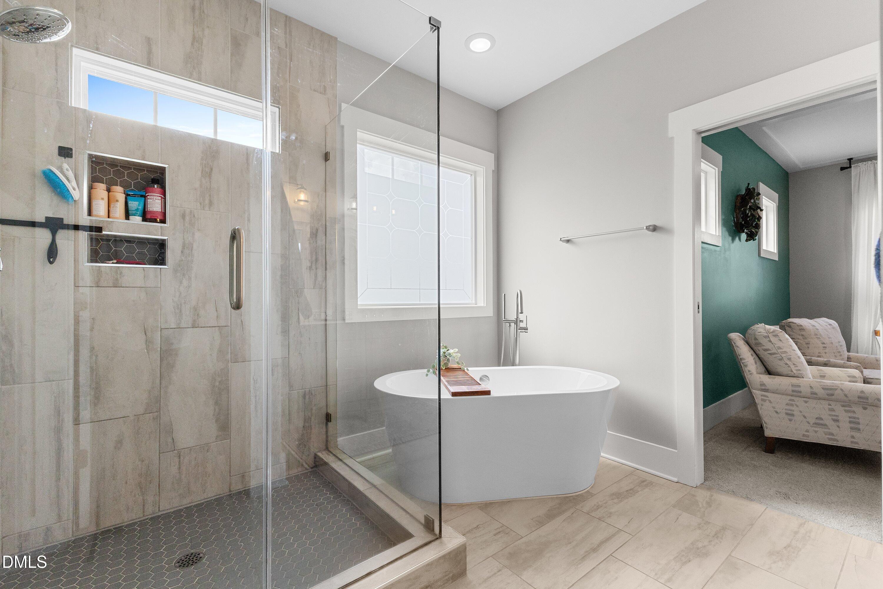 248 Old Hickory Drive Raleigh, NC 27603 - Photo 32 of 45 a bathroom with a tub a toilet and a shower