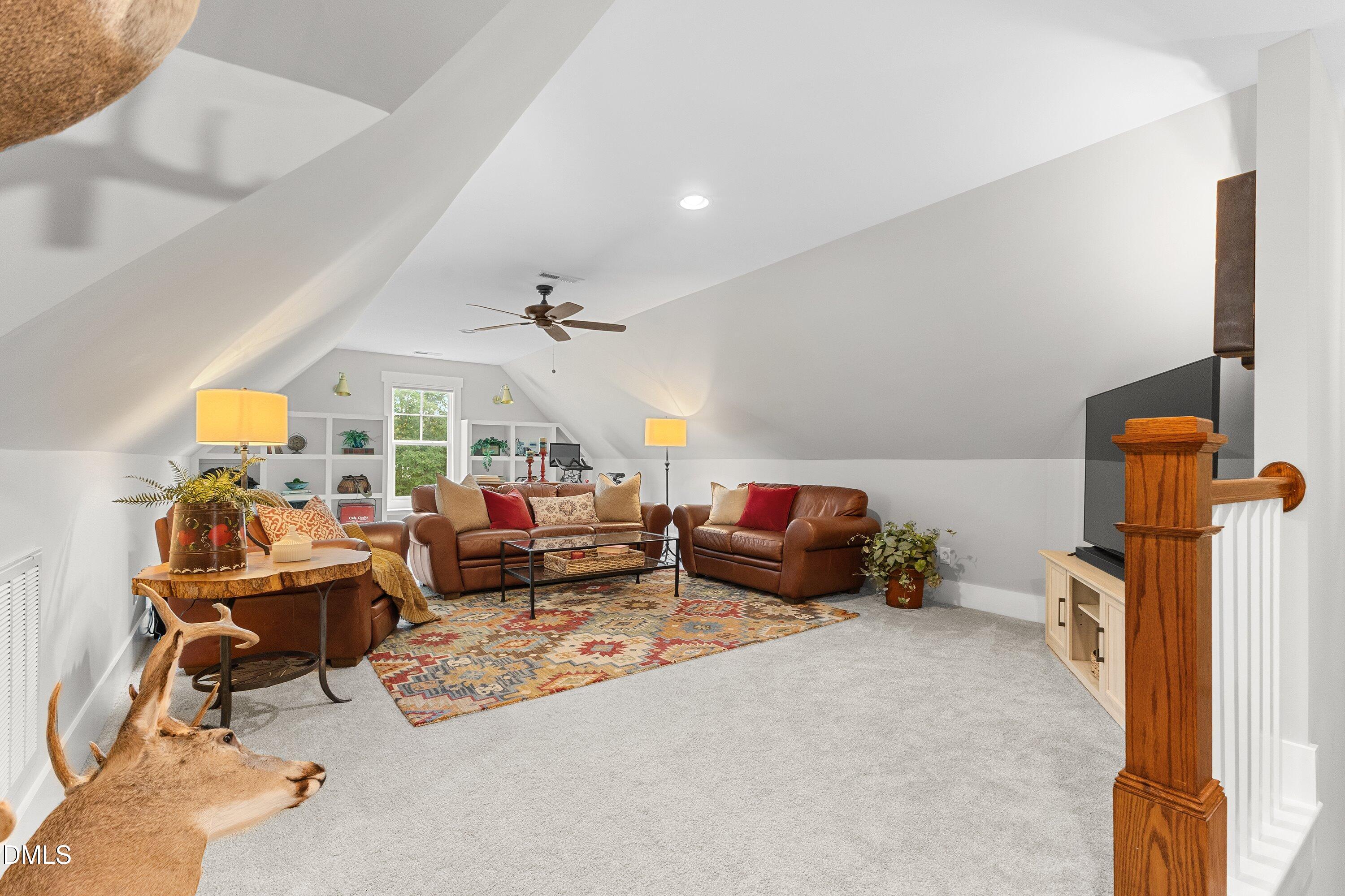 248 Old Hickory Drive Raleigh, NC 27603 - Photo 33 of 45 a living room with furniture and a chandelier