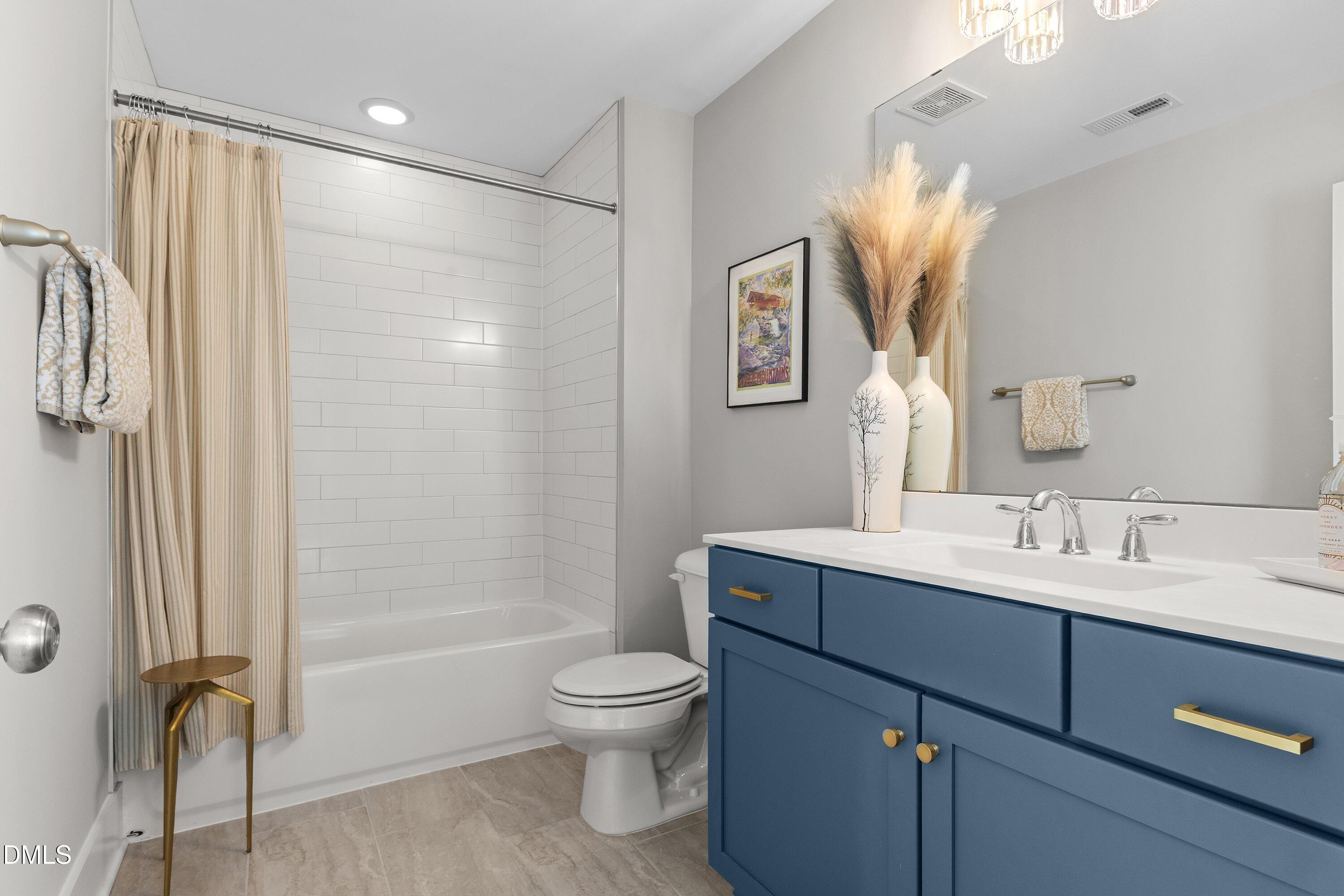 248 Old Hickory Drive Raleigh, NC 27603 - Photo 36 of 45 a bathroom with a sink a toilet and shower