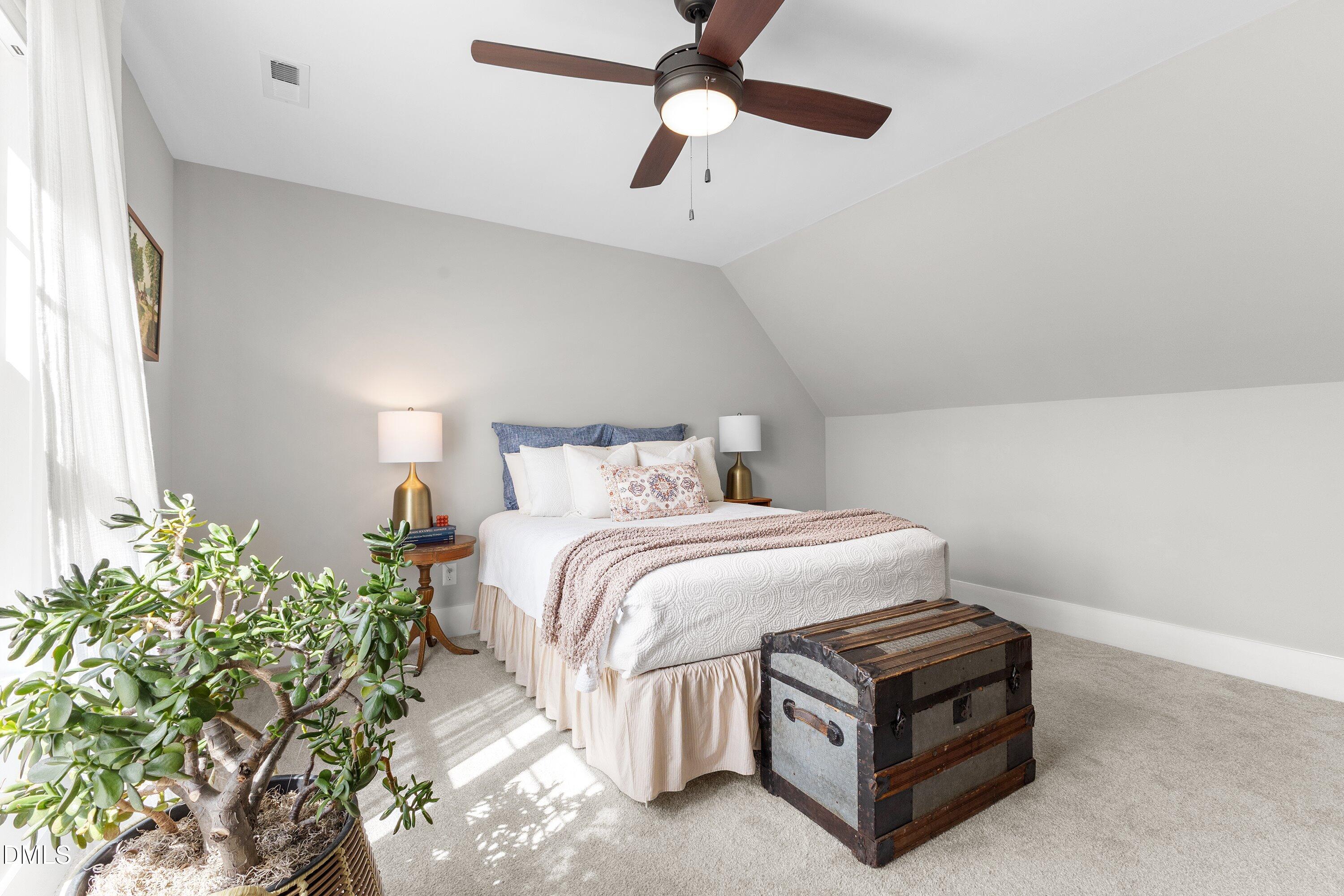 248 Old Hickory Drive Raleigh, NC 27603 - Photo 37 of 45 a bedroom with a bed chandelier and a window