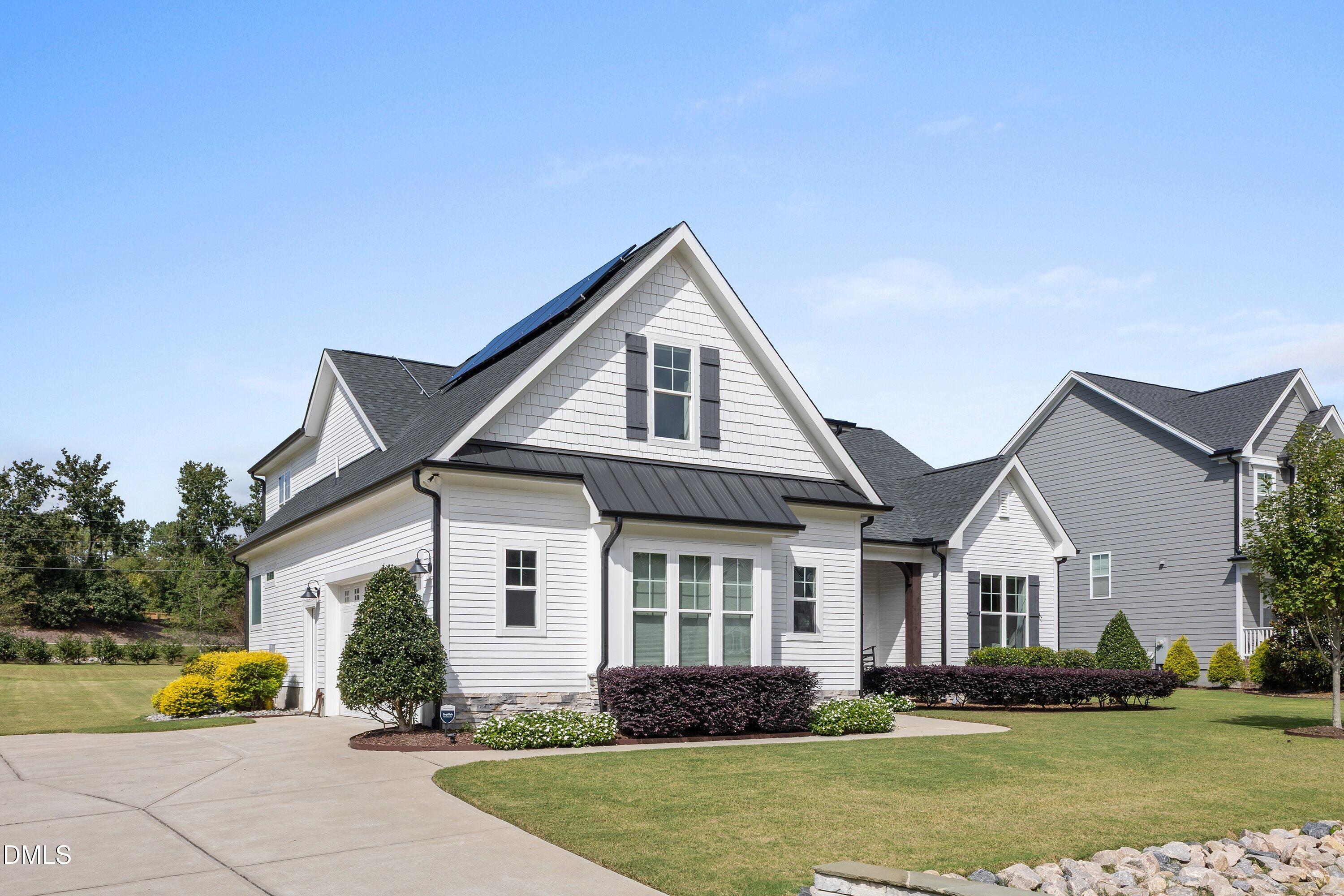 248 Old Hickory Drive Raleigh, NC 27603 - Photo 4 of 45 a front view of a house with a yard