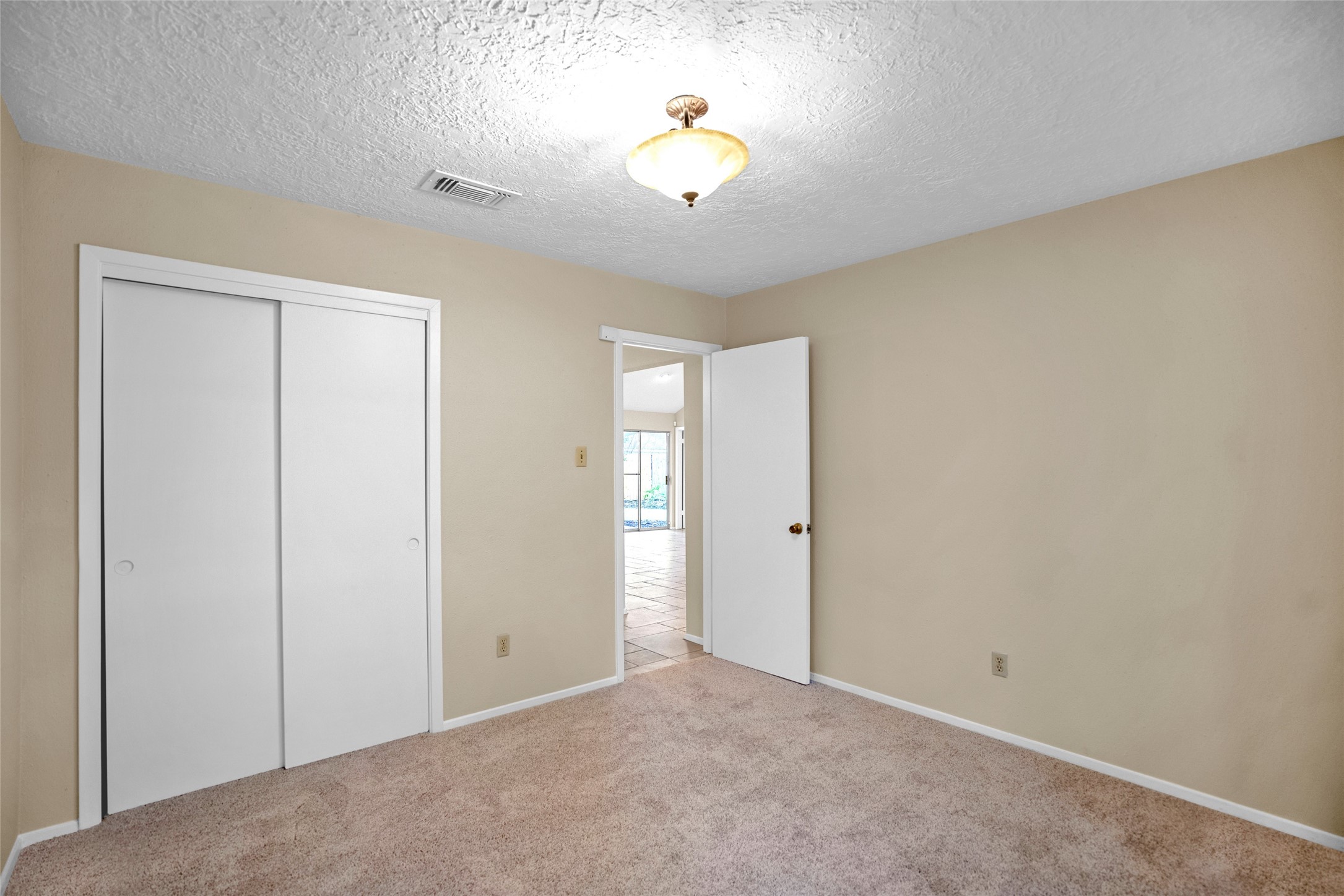 17323 Northchapel Street Spring, TX 77379 - Photo 20 of 37 Another view of bedroom with closet access and clean, move-in ready condition.