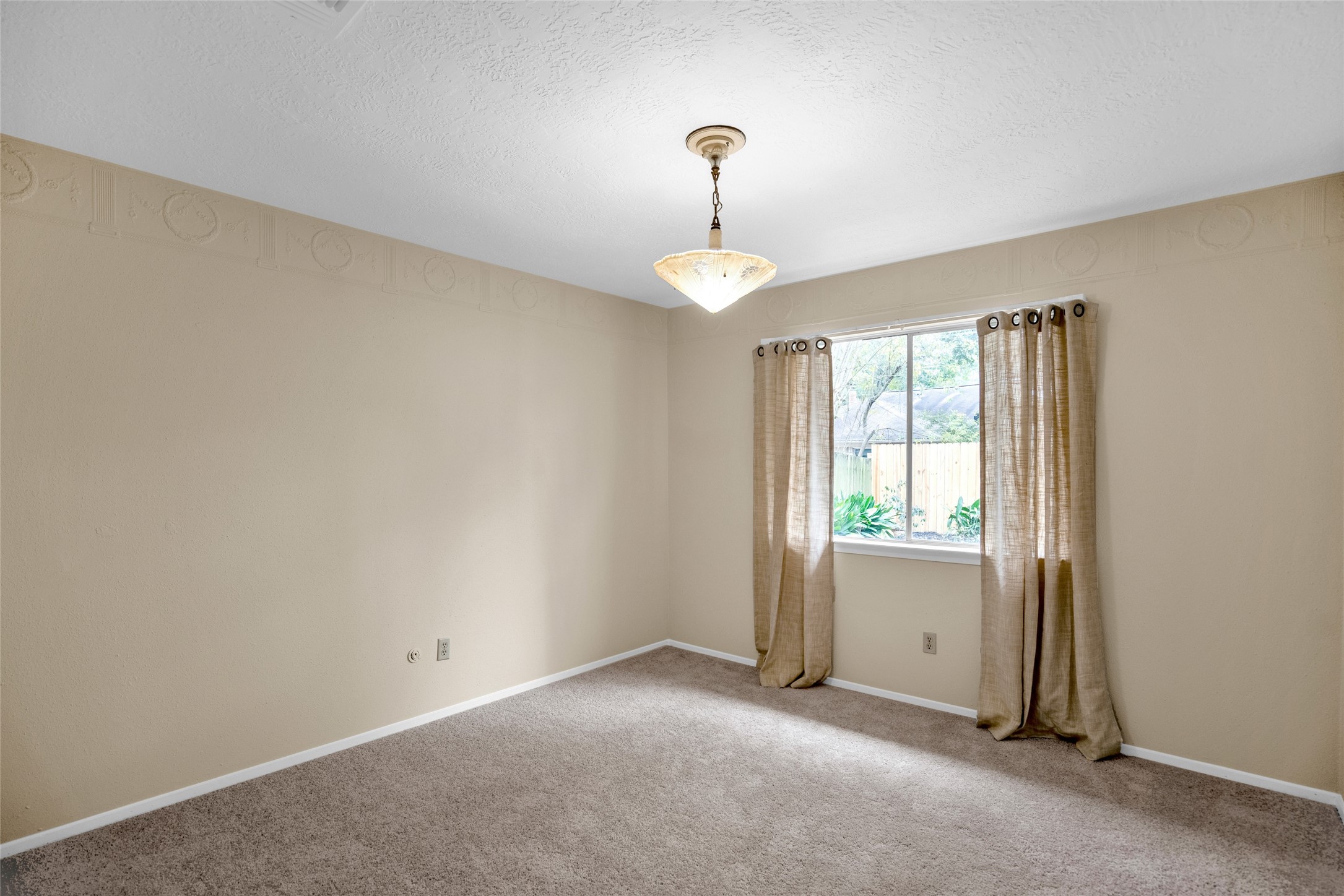 17323 Northchapel Street Spring, TX 77379 - Photo 23 of 37 ell-sized bedroom featuring carpet flooring and soft natural light.