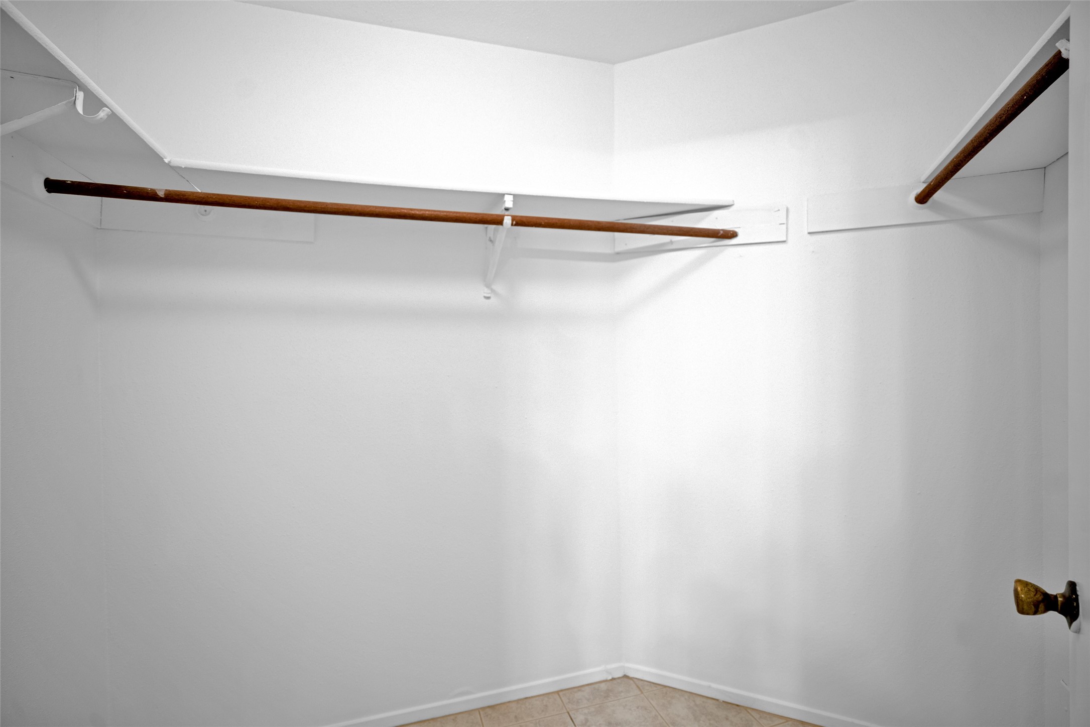 17323 Northchapel Street Spring, TX 77379 - Photo 33 of 37 Spacious walk-in closet with built-in shelving and ample hanging space.