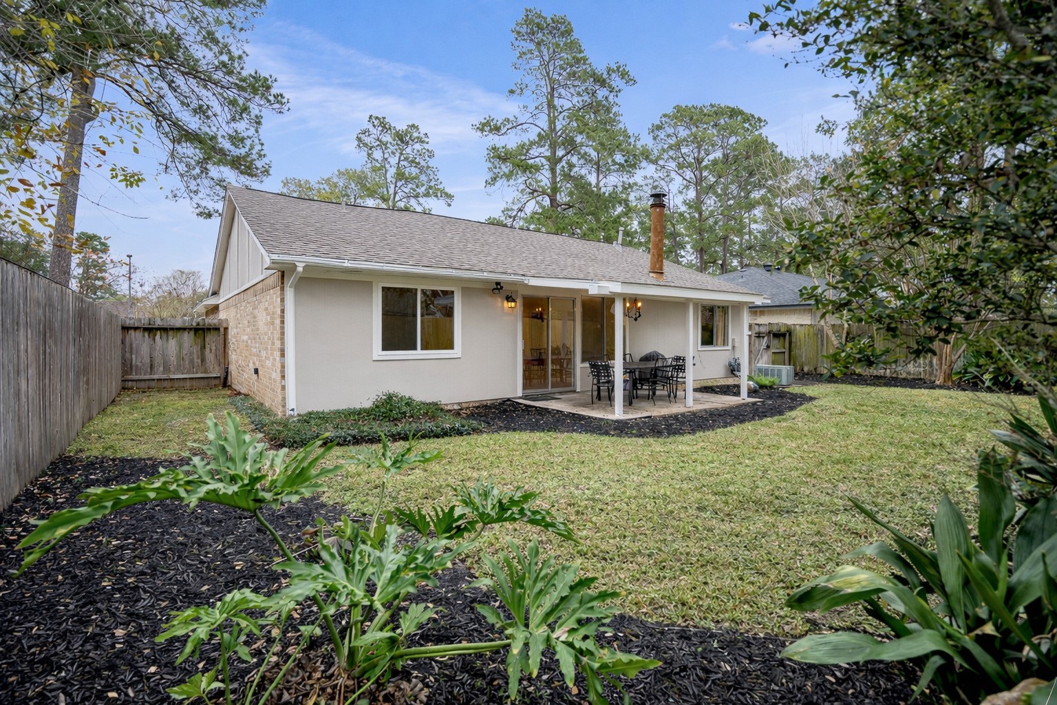 17323 Northchapel Street Spring, TX 77379 - Photo 35 of 37 Well-maintained exterior with clean lines and neutral tones. Backyard offers privacy and a peaceful setting.