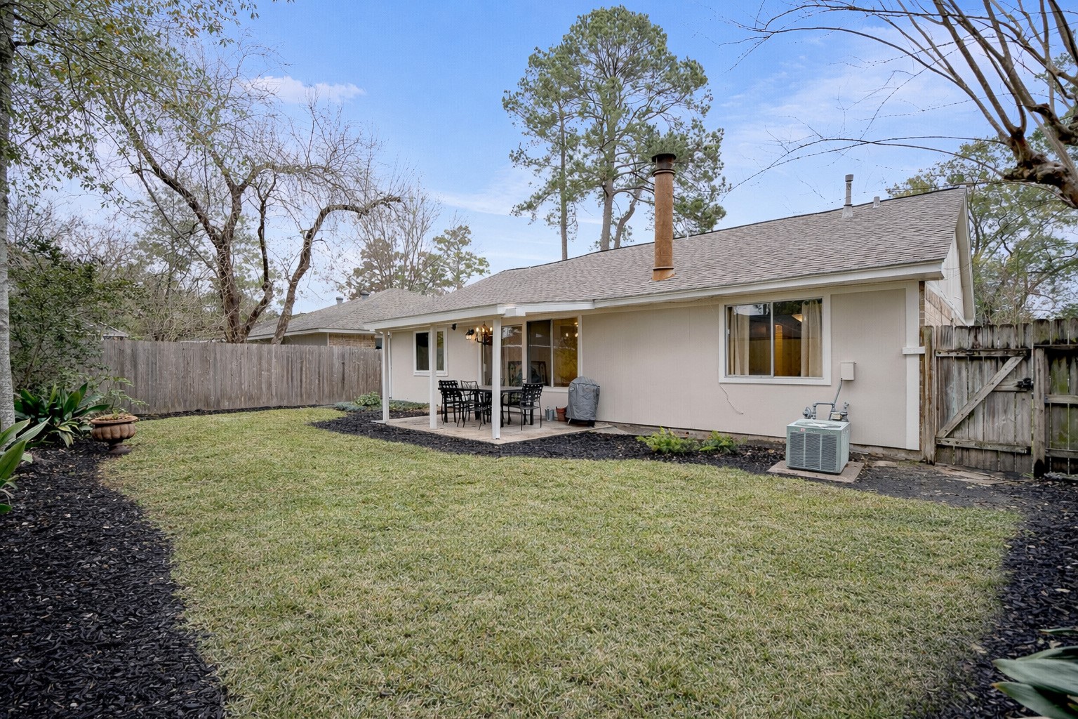 17323 Northchapel Street Spring, TX 77379 - Photo 36 of 37 Spacious backyard with mature trees and room for outdoor entertaining or play. Fully fenced with plenty of green space and natural shade.