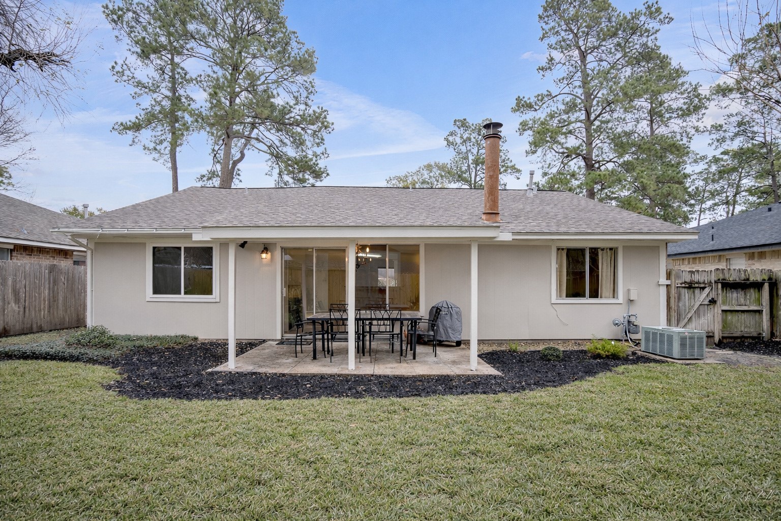 17323 Northchapel Street Spring, TX 77379 - Photo 37 of 37 Covered patio overlooking the backyard, ideal for outdoor dining or relaxing. Easy access from the home with plenty of space for seating.