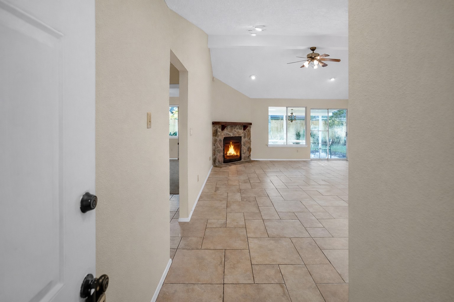 17323 Northchapel Street Spring, TX 77379 - Photo 5 of 37 Welcoming entry with neutral paint, tile flooring, and clean lines leading into the main living space.