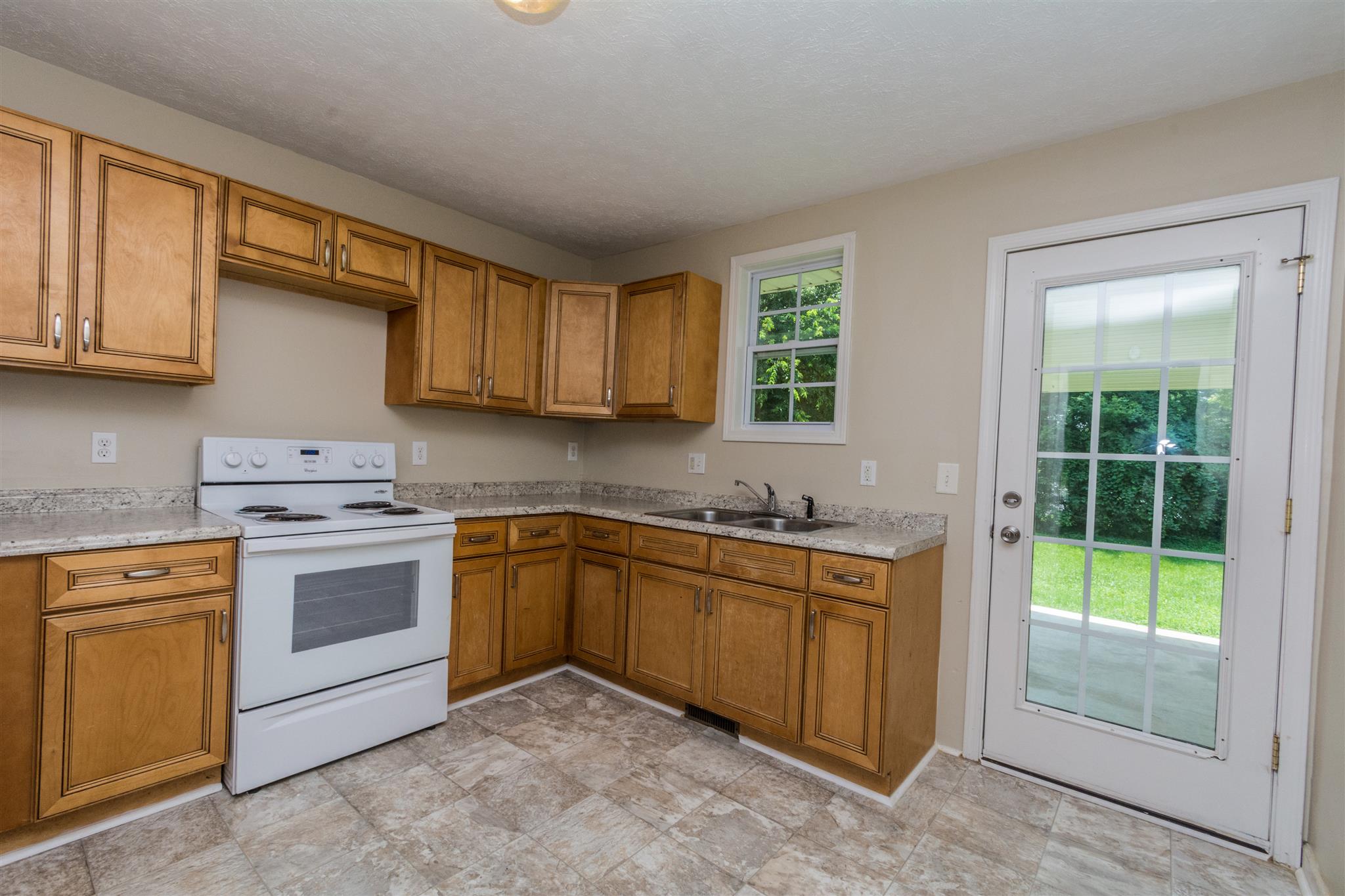 318 Burch Road Clarksville, TN 37042 - Photo 11 of 15 a kitchen with a stove sink and cabinets
