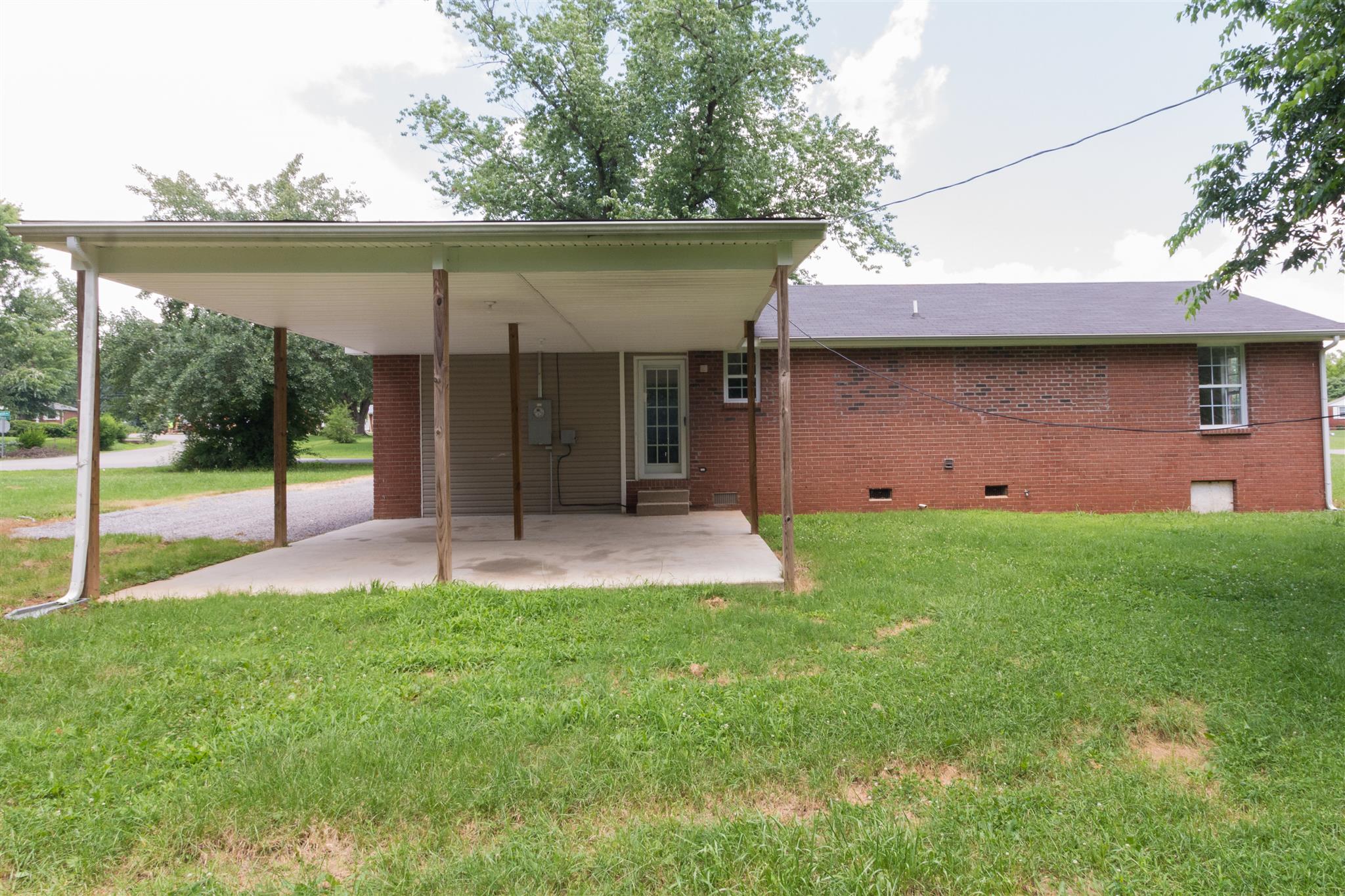 318 Burch Road Clarksville, TN 37042 - Photo 15 of 15 a view of a house with a backyard and a garden