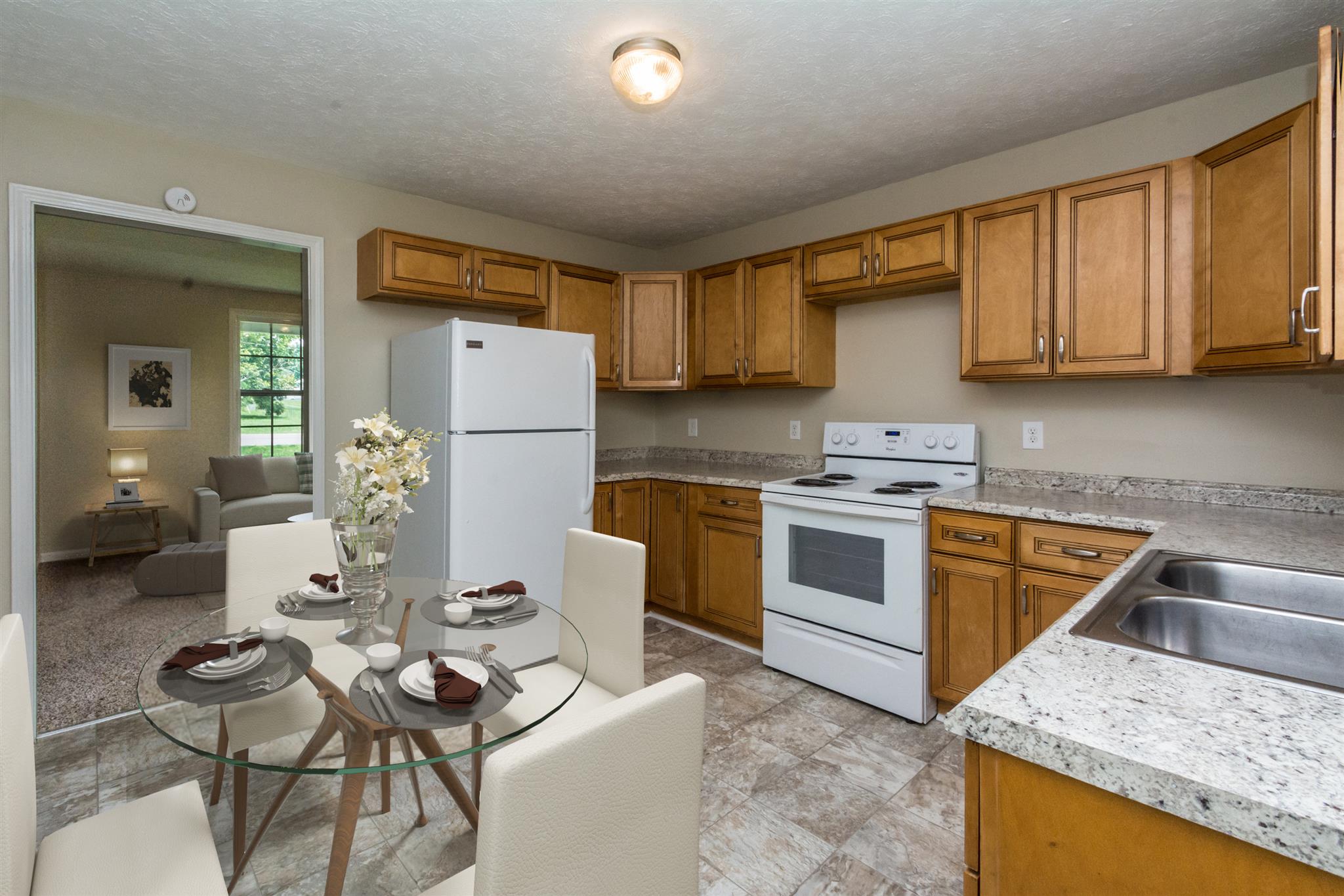 318 Burch Road Clarksville, TN 37042 - Photo 3 of 15 a kitchen with stainless steel appliances granite countertop a sink a stove a refrigerator cabinets and living room view