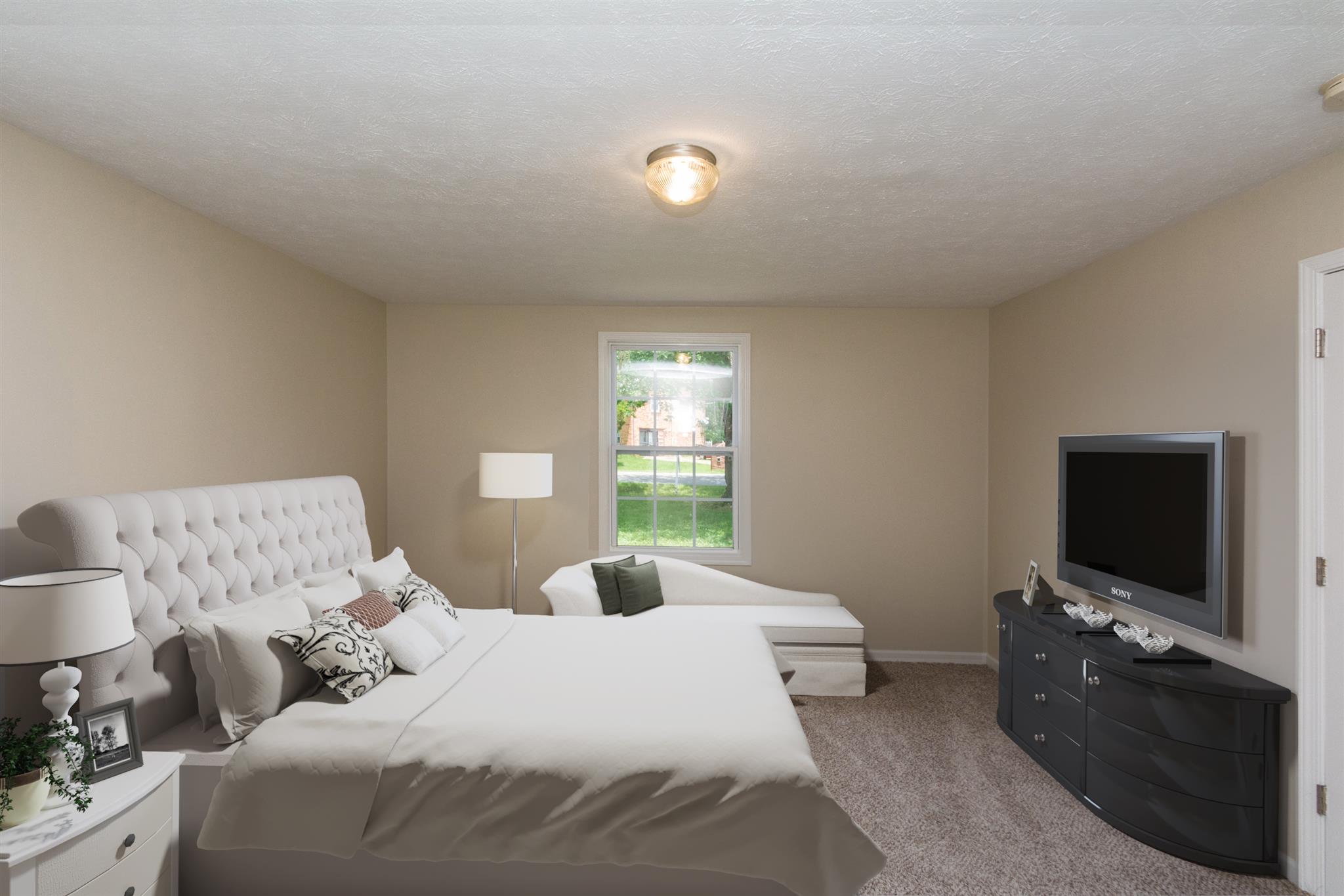 318 Burch Road Clarksville, TN 37042 - Photo 4 of 15 a bedroom with a bed and a flat screen tv