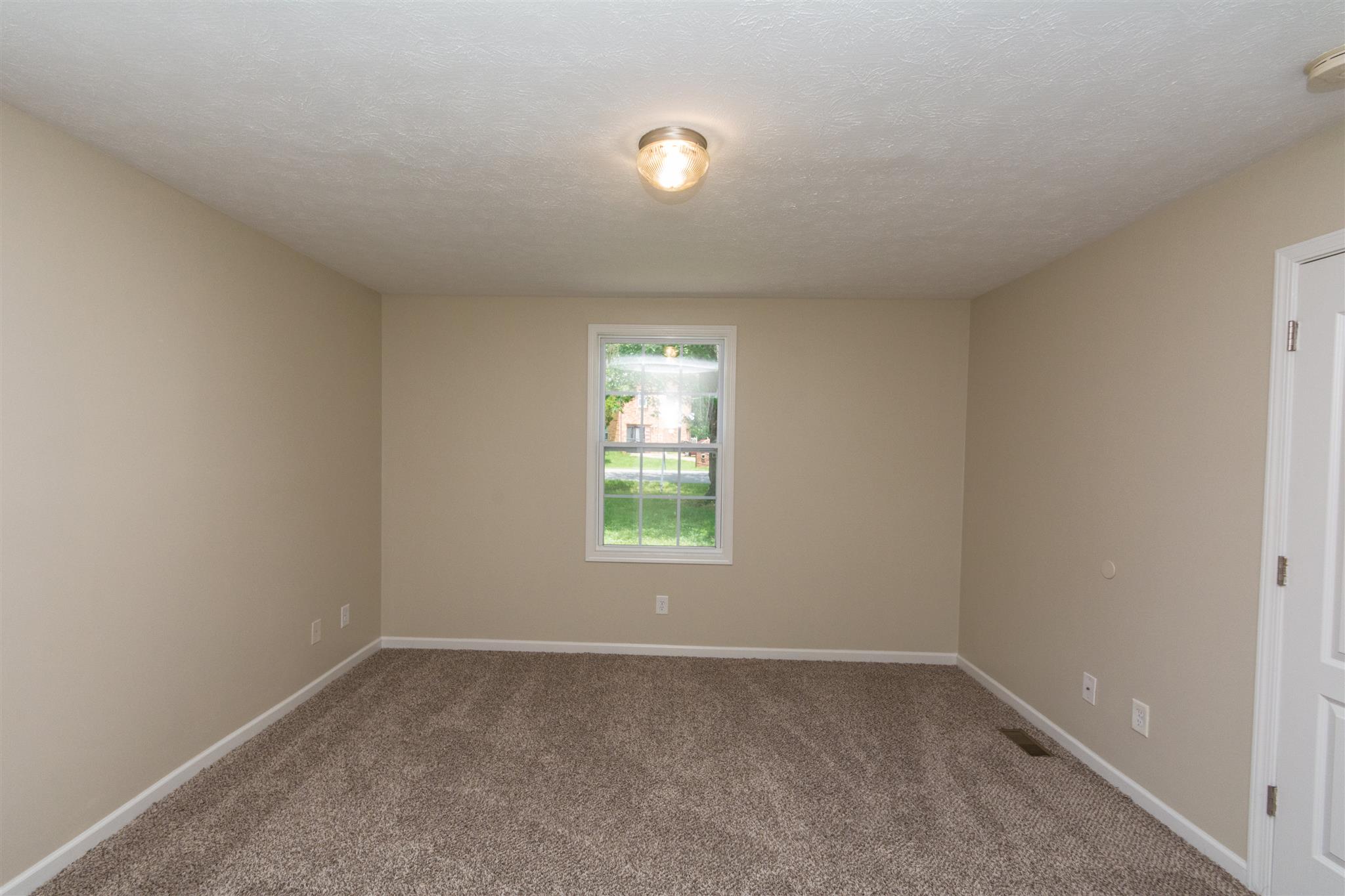 318 Burch Road Clarksville, TN 37042 - Photo 7 of 15 an empty room with a window and a fan