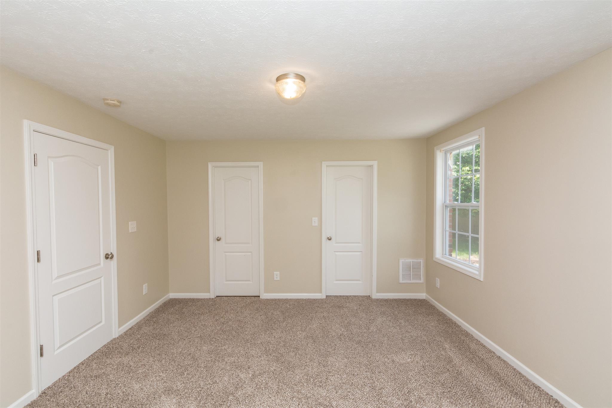 318 Burch Road Clarksville, TN 37042 - Photo 8 of 15 a view of an empty room with closet and window