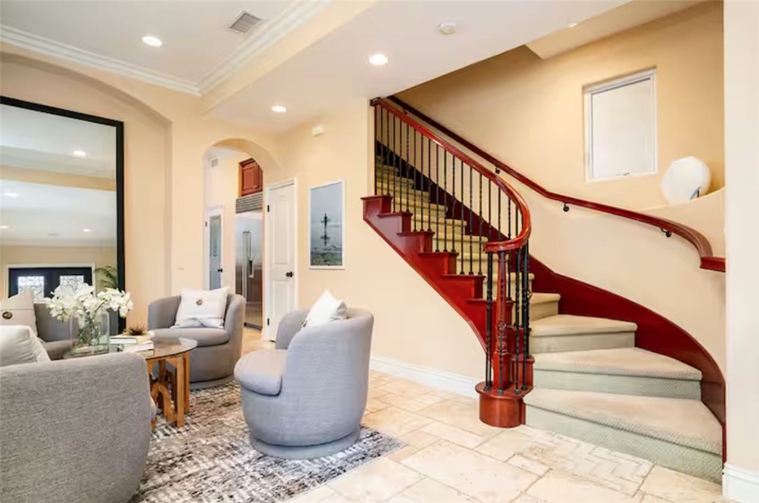301 16th Street Huntington Beach, CA 92648 - Photo 16 of 16 a living room with furniture and stairs