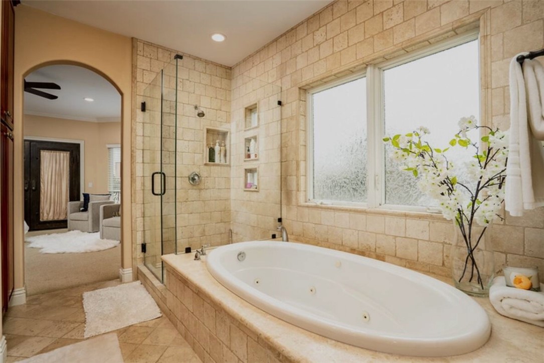 301 16th Street Huntington Beach, CA 92648 - Photo 5 of 16 a bathroom with a bathtub and a shower