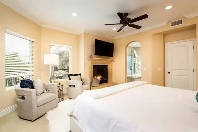 a bed room with bed and a flat screen tv