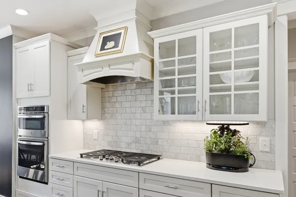 a kitchen with a cabinets and a stove top oven