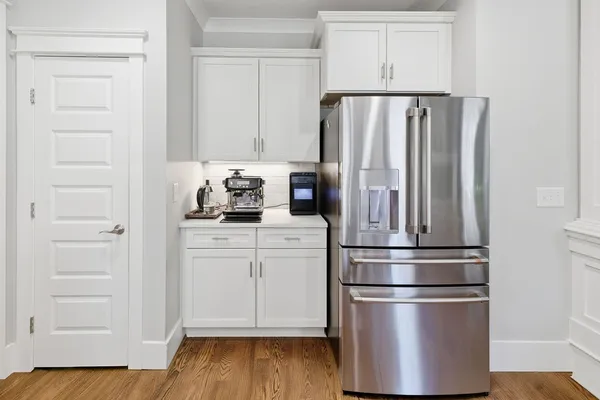 a kitchen with appliances and cabinets