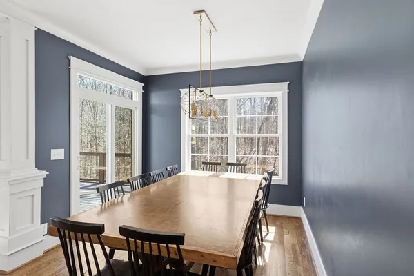 a view of a dining room with furniture window and outside view