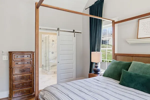 a bedroom with a bed and closet