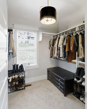 a living room with a couch and a window