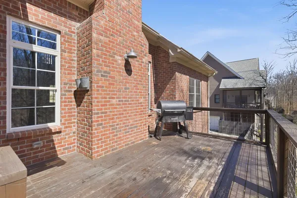 an aerial view of a house with swimming pool and a yard
