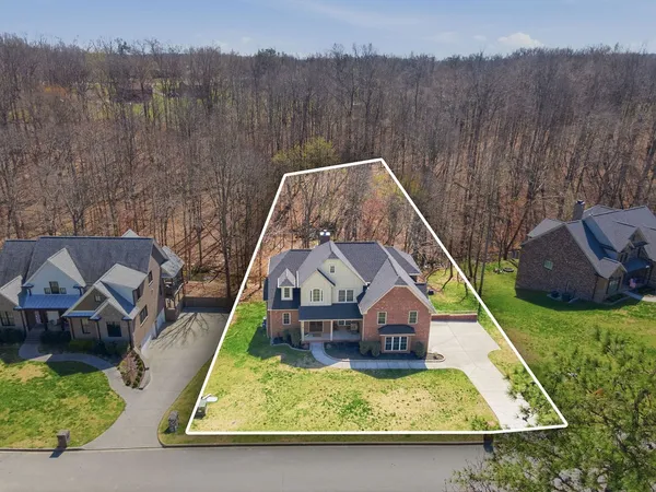 a view of a backyard of the house
