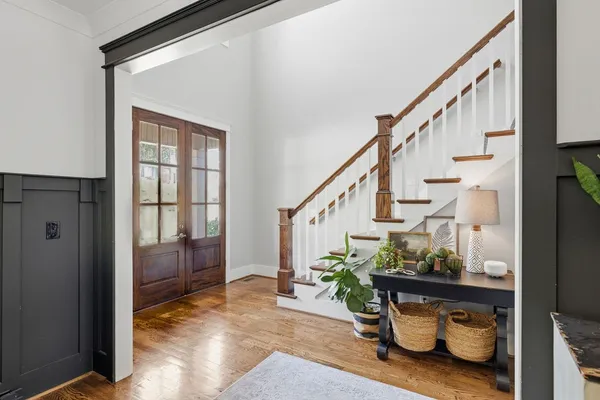 a view of entryway and hall with wooden floor