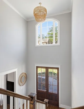 a view of a hallway with windows