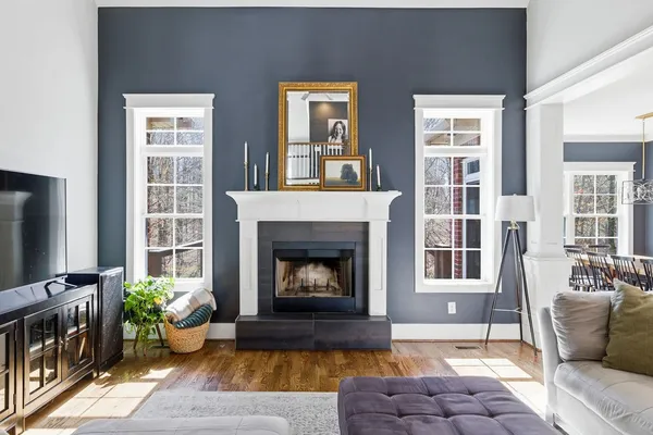 a living room with furniture and a fireplace