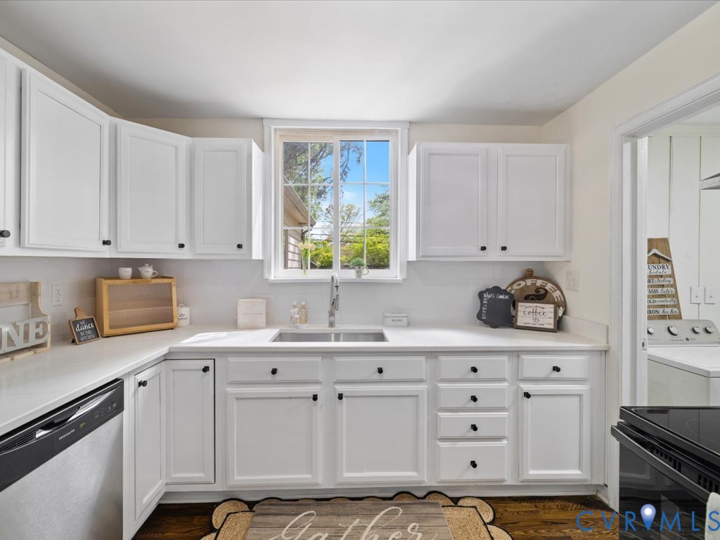 4803 Morrison Road Richmond, VA 23230 - Photo 16 of 45 a kitchen with cabinets appliances a sink and a window