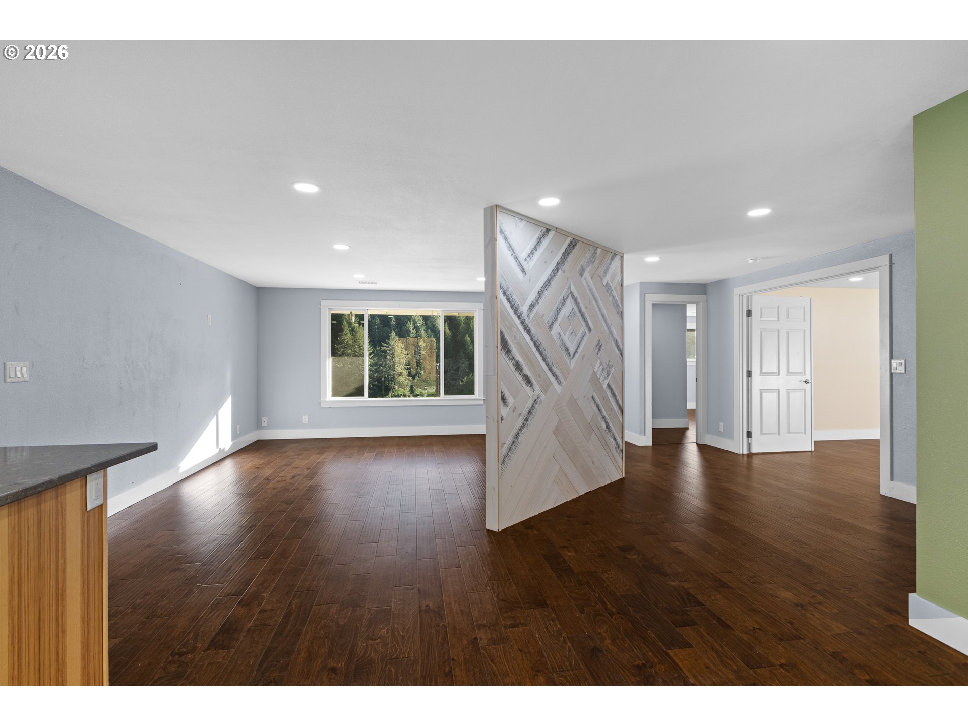 16855 Highway 42 Myrtle Point, OR 97458 - Photo 14 of 43 a view of an empty room with wooden floor and stairs