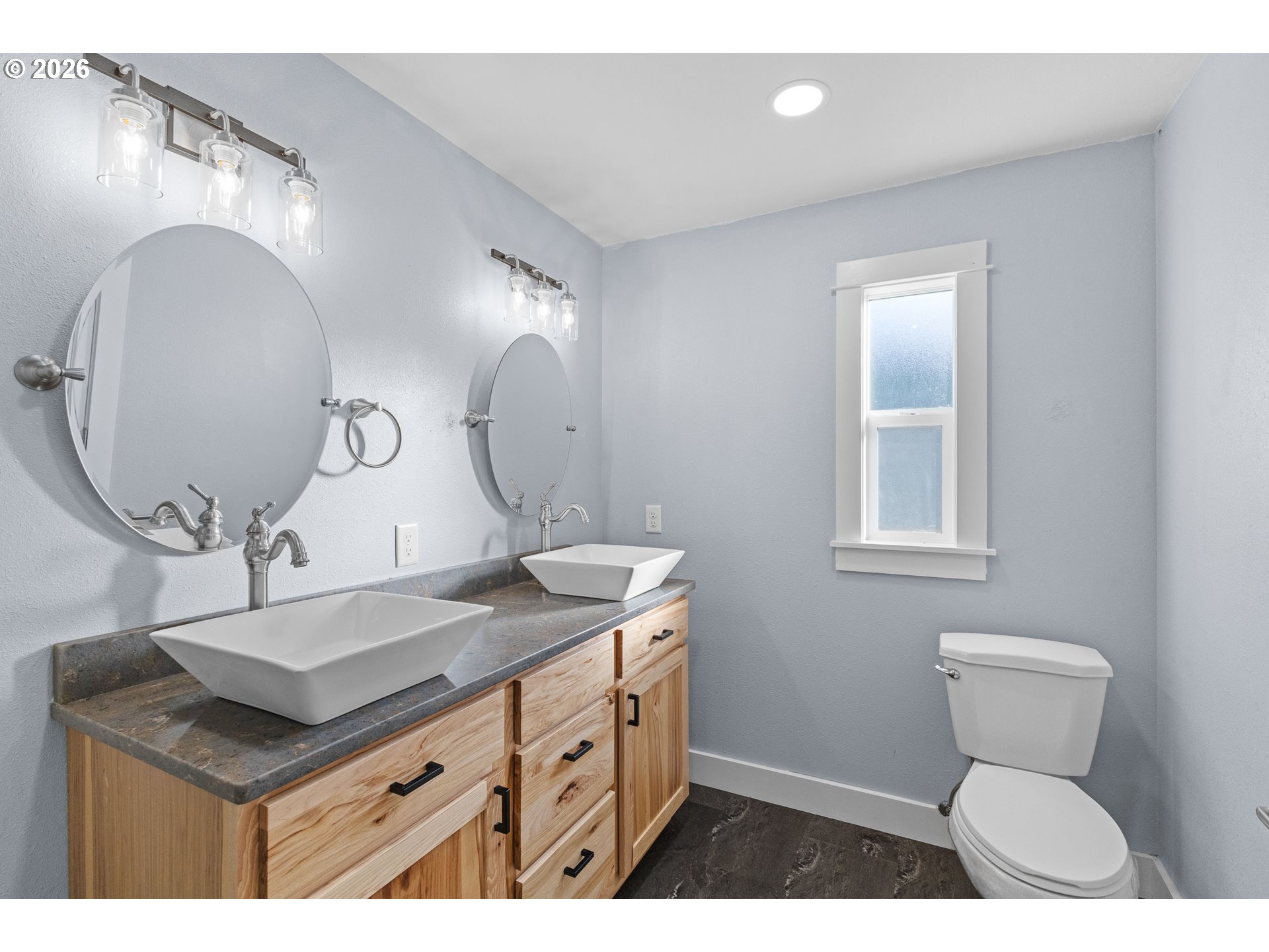 16855 Highway 42 Myrtle Point, OR 97458 - Photo 29 of 43 a bathroom with a sink a vanity and a mirror
