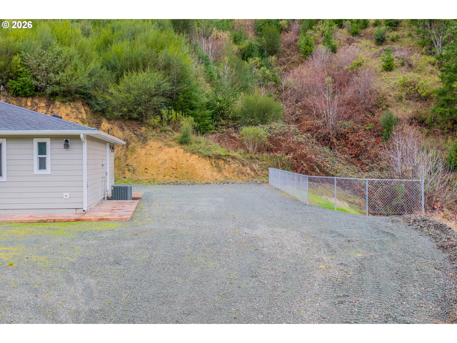16855 Highway 42 Myrtle Point, OR 97458 - Photo 40 of 43 a view of a backyard with plants and large tree