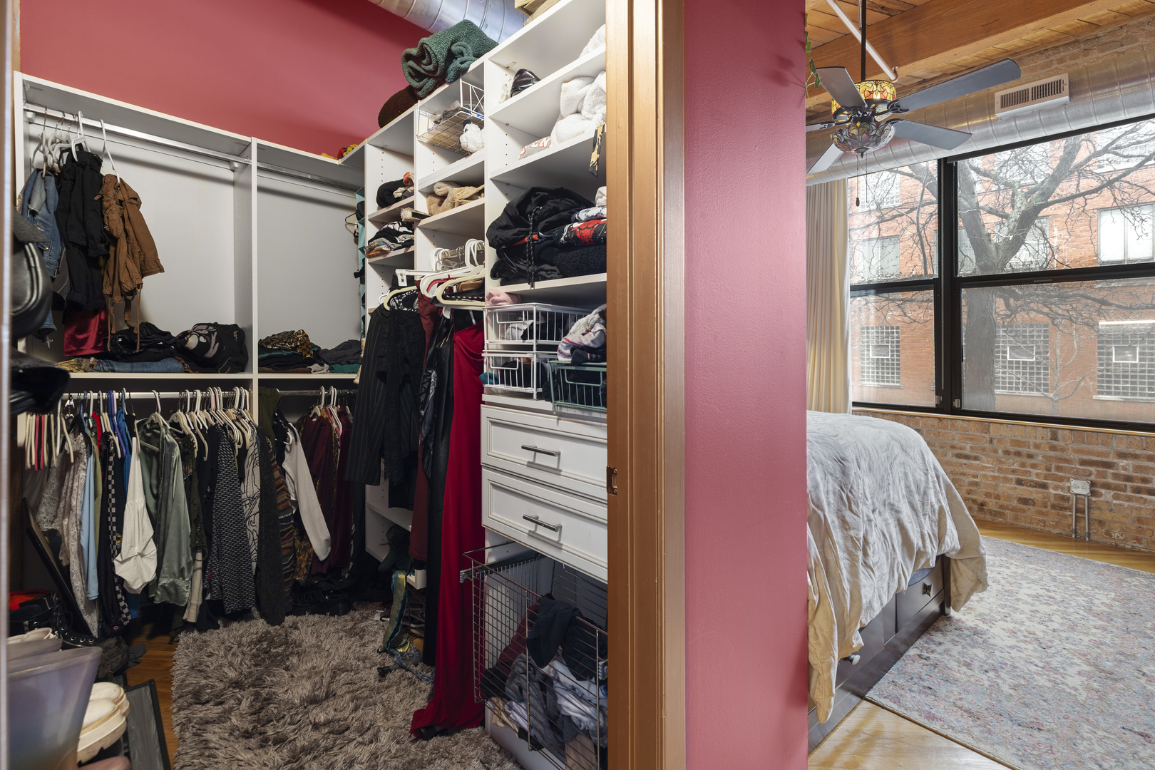 1040 West Adams Street, Unit 105 Chicago, IL 60607 - Photo 12 of 18 a view of walk in closet with clothes and shoes