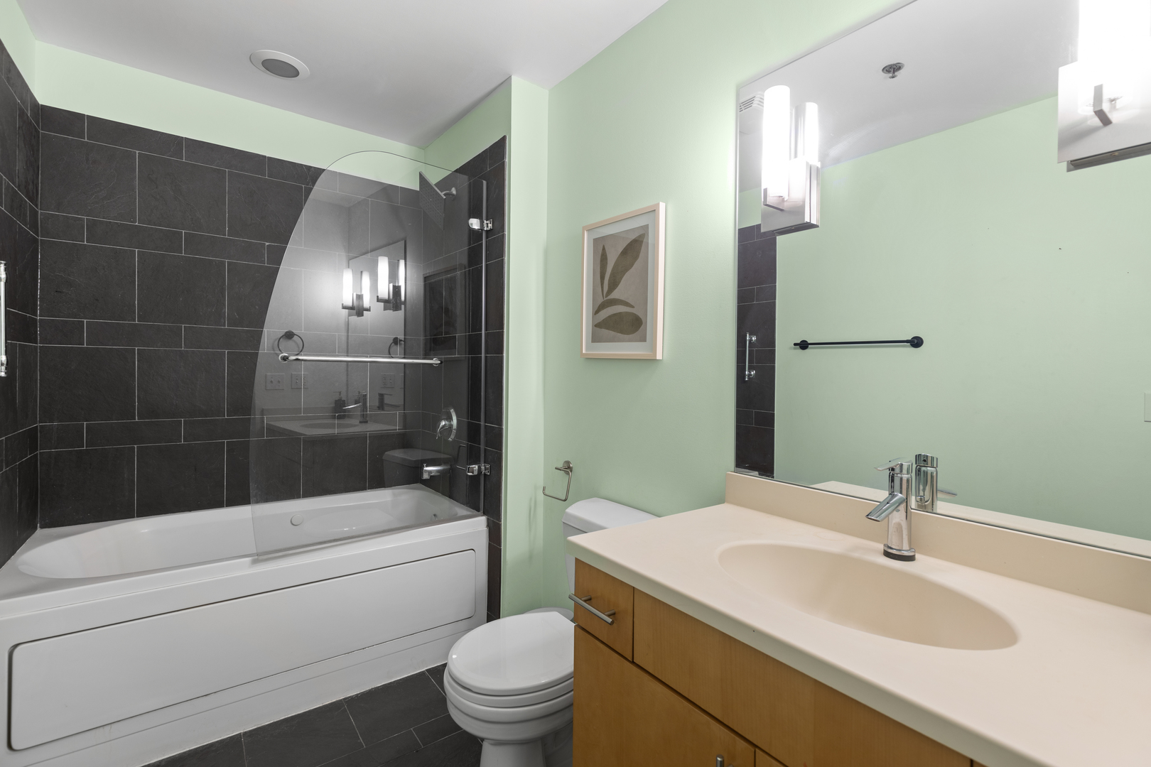 1040 West Adams Street, Unit 105 Chicago, IL 60607 - Photo 15 of 18 a bathroom with a sink a toilet and shower