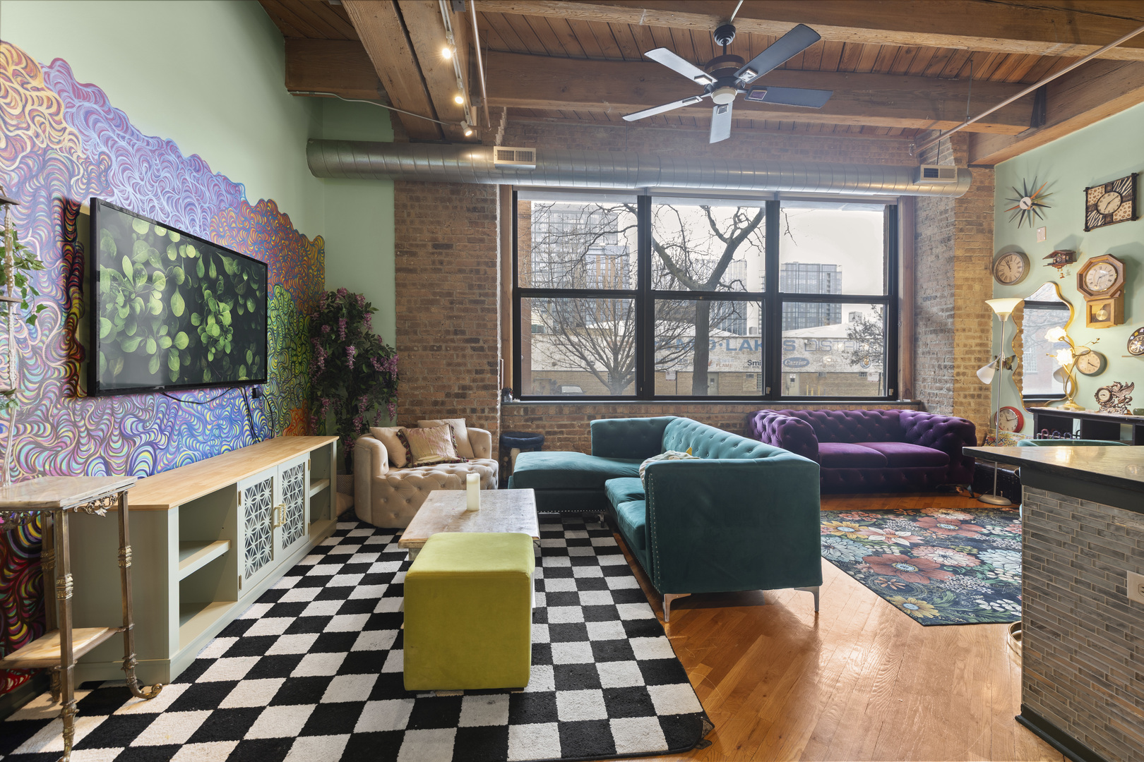1040 West Adams Street, Unit 105 Chicago, IL 60607 - Photo 3 of 18 a living room with furniture and a flat screen tv